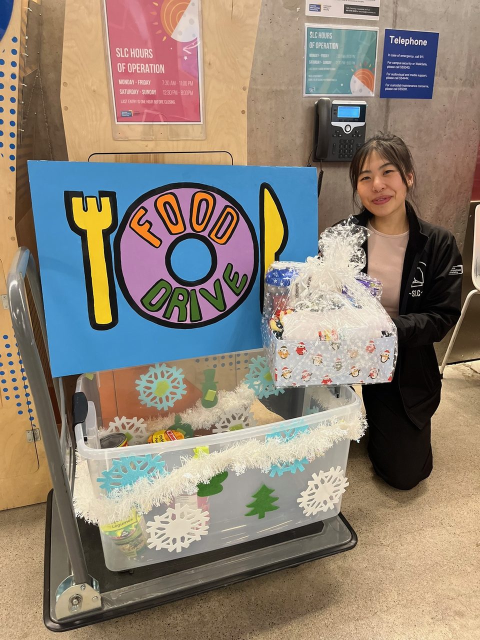 Donations for a local food and clothing drive, with hand-crocheted snowflakes