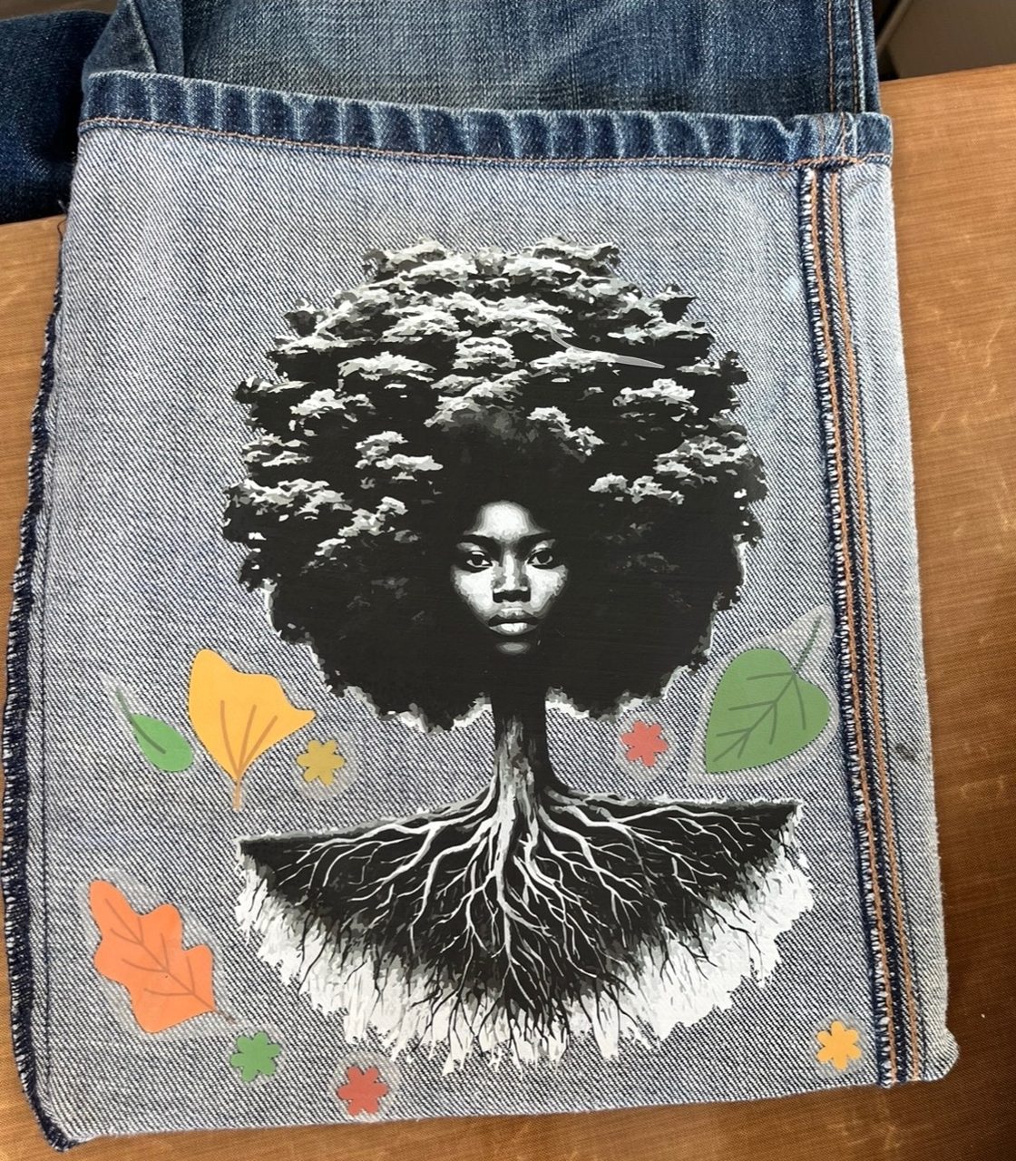 Denim bag with rooted-tree appliqué