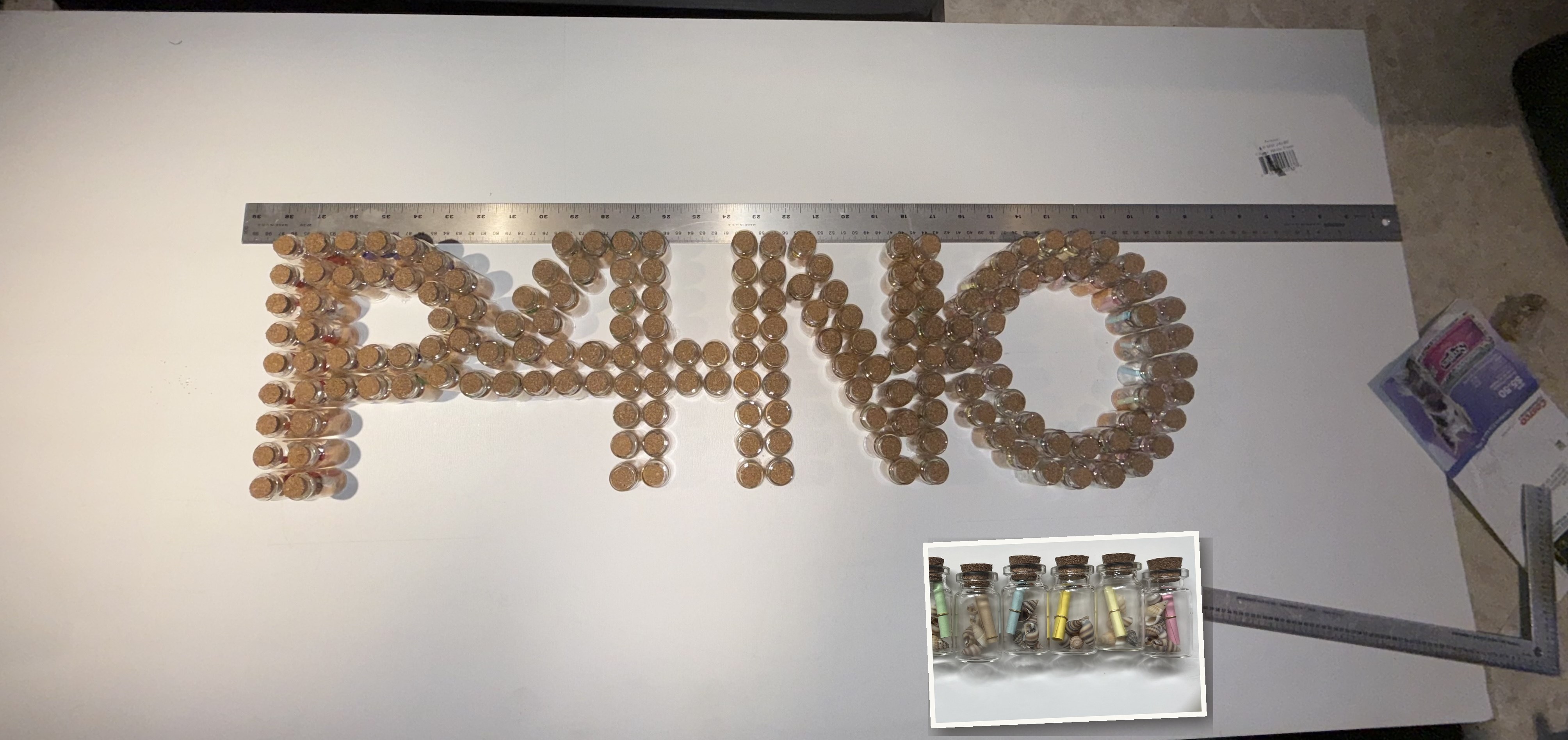 P4NO logo spelled in corked vials for the Performing 4 No One production